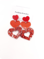 Boucles d'oreilles en forme de cœurs rouges