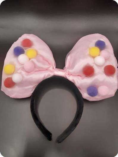 Grote roze strik met gekleurde bollen diadeem